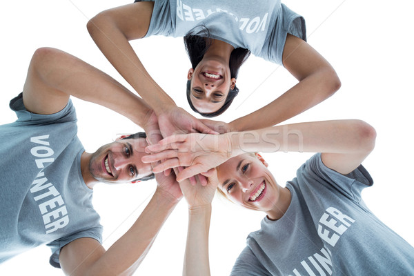 Happy volunteers putting their hands together  Stock photo © wavebreak_media