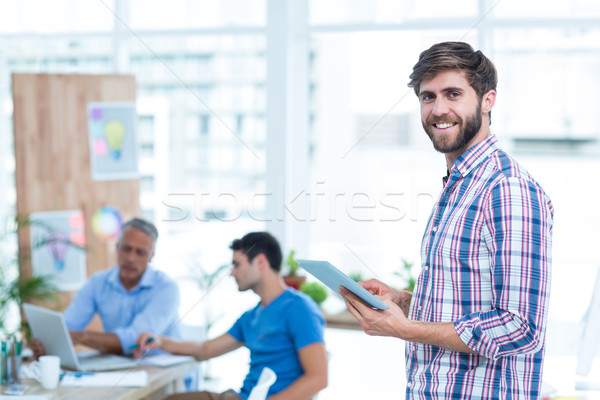 Geschäftsmann halten Tablet gut aussehend Büro Mann Stock foto © wavebreak_media