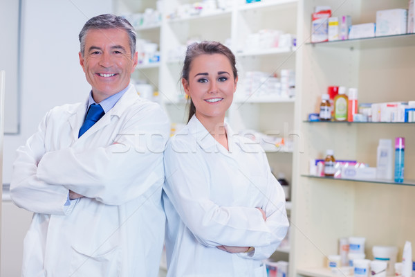 Pharmacist with his trainee standing with arms crossed Stock photo © wavebreak_media