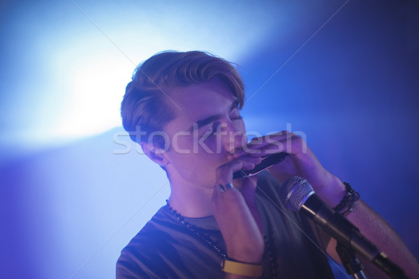 Müzisyen oynama ağız organ gece kulübü Stok fotoğraf © wavebreak_media