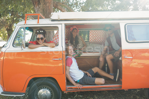 Portrait of friends sitting in camper van Stock photo © wavebreak_media