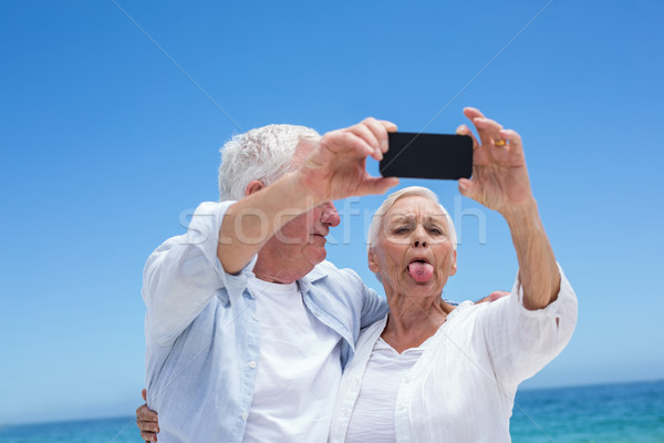 женщину телефон человека счастливым Сток-фото © wavebreak_media