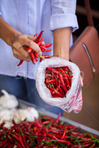Woman buying red chilies Stock photo © wavebreak_media