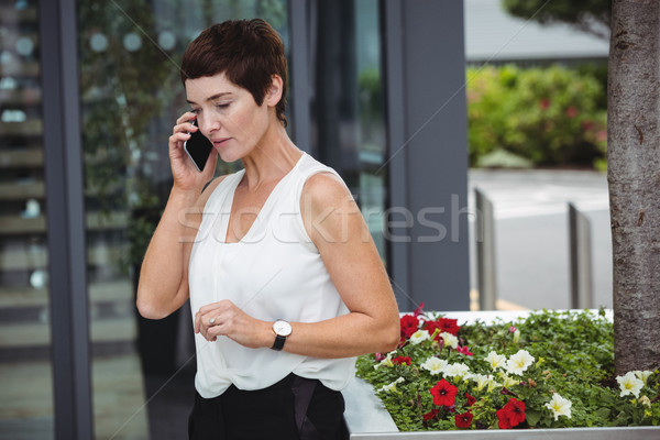 Businesswoman talking on mobile phone Stock photo © wavebreak_media
