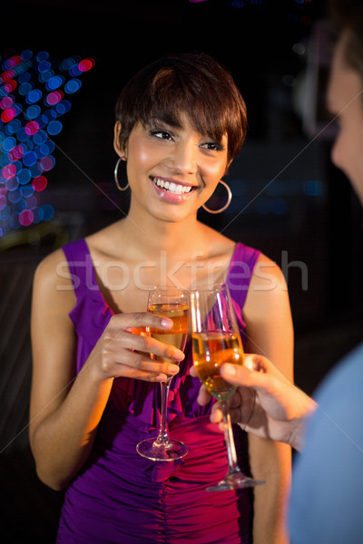 Couple toasting glass of champagne in bar Stock photo © wavebreak_media