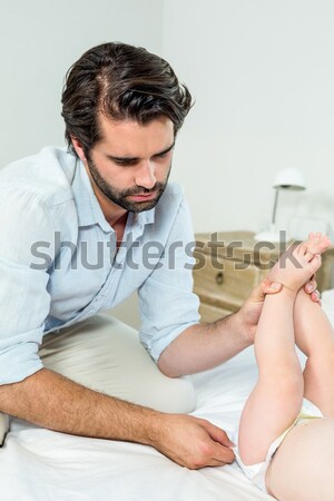 Stock photo: A doctor performimg a CPR with a defibrillator