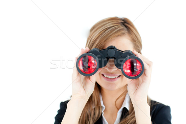 Positive businesswoman looking through binoculars Stock photo © wavebreak_media