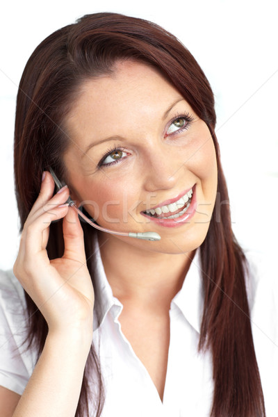Cheerful young businesswoman with earpiece Stock photo © wavebreak_media
