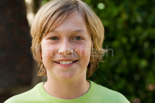 Little boy looking at the camera in the garden Stock photo © wavebreak_media
