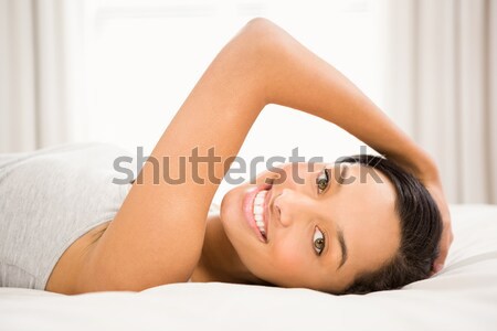 Kadın yatak yatak odası el gülümseme yüz Stok fotoğraf © wavebreak_media