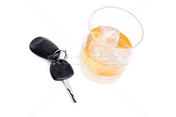 Car key next to a whiskey against a white background Stock photo © wavebreak_media