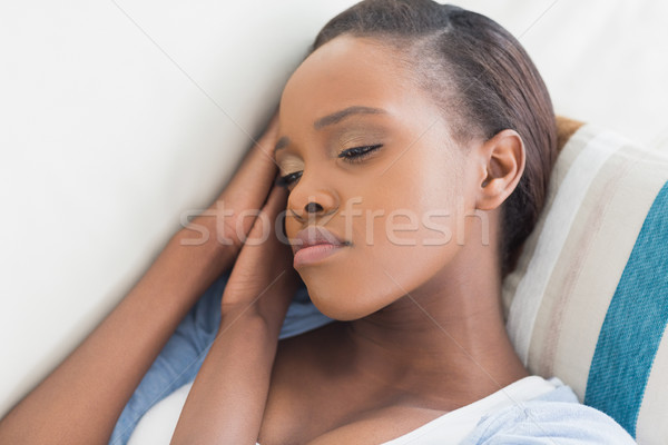 Sad black woman lying in a living room Stock photo © wavebreak_media