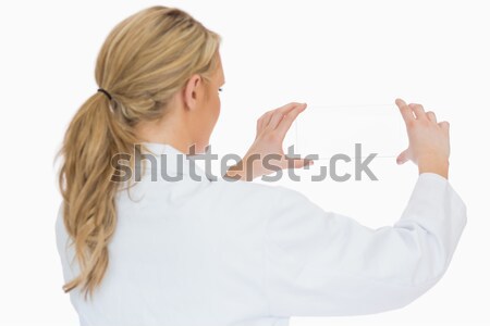 Szőke nő női orvos valami levegő kéz Stock fotó © wavebreak_media