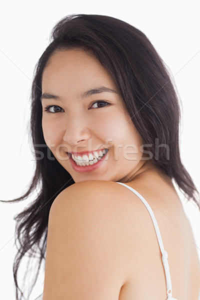 Young woman smiling at camera while looking natural Stock photo © wavebreak_media