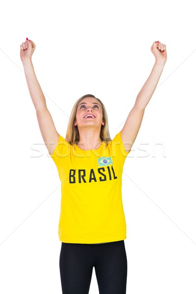 Stock photo: Excited football fan in brasil tshirt