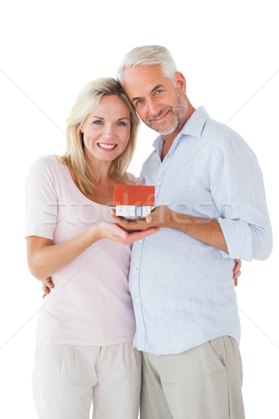 Happy couple holding miniature model house Stock photo © wavebreak_media