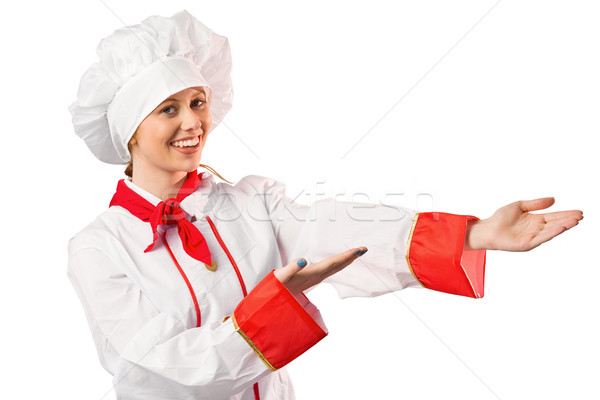 Pretty chef presenting with hands Stock photo © wavebreak_media