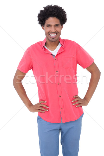 Happy man posing with hands on hips Stock photo © wavebreak_media
