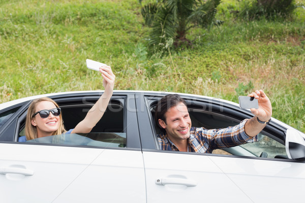 Couple taking selfies  Stock photo © wavebreak_media