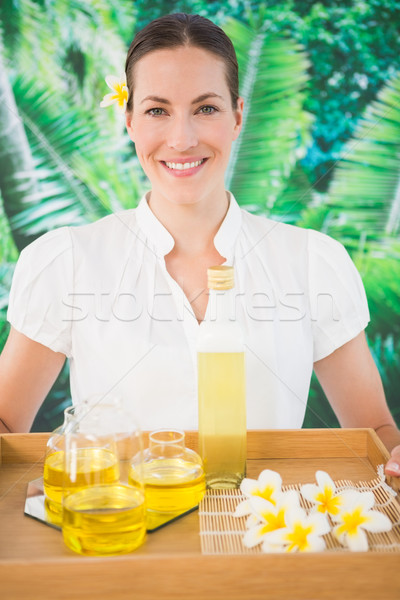 Smiling beauty therapist holding tray of beauty treatments Stock photo © wavebreak_media