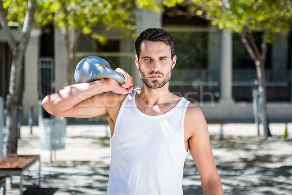 Handsome athlete outfit with a kettlebell Stock photo © wavebreak_media