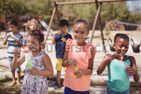 Souriant jouer bulle école aire de jeux [[stock_photo]] © wavebreak_media