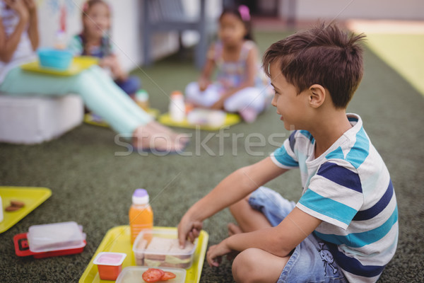 Gelukkig schooljongen maaltijd school meisje gras Stockfoto © wavebreak_media