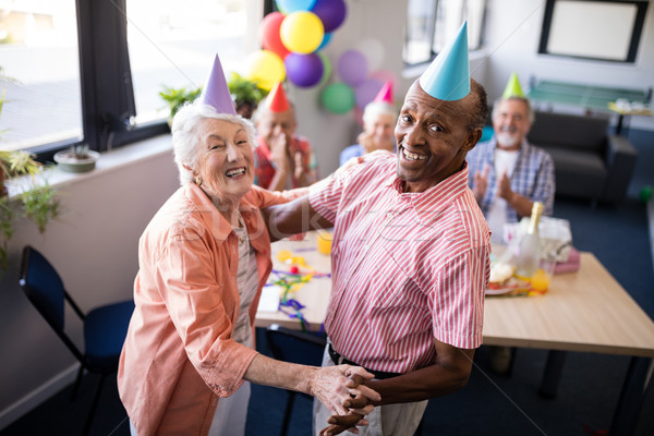 Retrato feliz pareja de ancianos baile fiesta mesa Foto stock © wavebreak_media