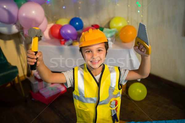 Boy pretending as a worker during birthday party Stock photo © wavebreak_media