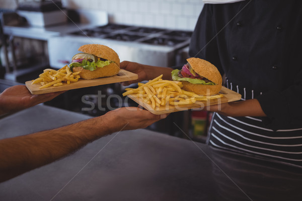 Mid section of waitress giving food to coworker Stock photo © wavebreak_media
