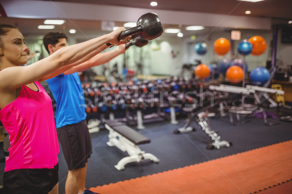 Fit couple working out in weights room Stock photo © wavebreak_media