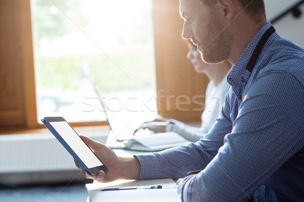 Mature student using digital tablet Stock photo © wavebreak_media