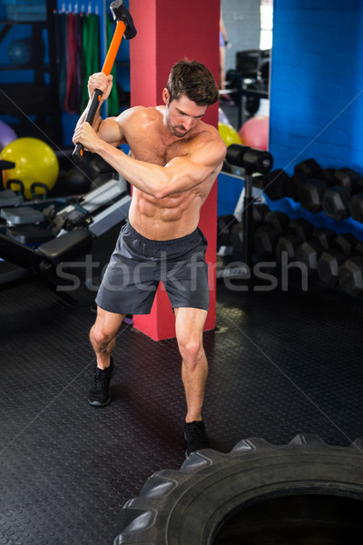 Homme Swing exercice jeunes torse nu gymnase [[stock_photo]] © wavebreak_media