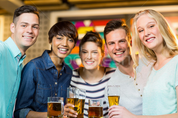 Group of friends having glass of beer in party Stock photo © wavebreak_media