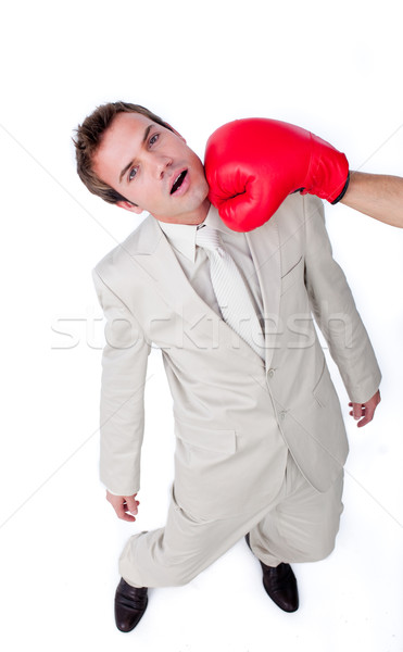Caucasian businessman being hit with a boxing glove  Stock photo © wavebreak_media