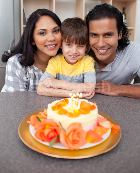 Attentive parents celebrating their son's birthday in the kitchen Stock photo © wavebreak_media