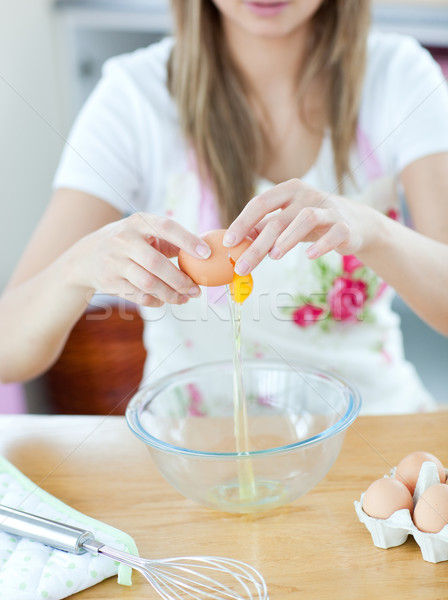 Close-up of a young woman preparing a cake in the kitchen Stock photo © wavebreak_media