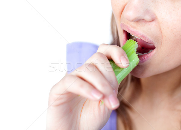 Primer plano mujer comer apio blanco espacio Foto stock © wavebreak_media