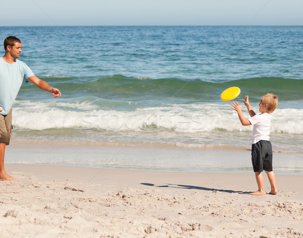 Little boy playing frisbee with his father Stock photo © wavebreak_media
