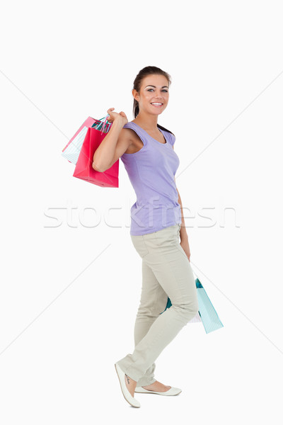 Vue de côté jeunes Homme Shopping blanche sac [[stock_photo]] © wavebreak_media