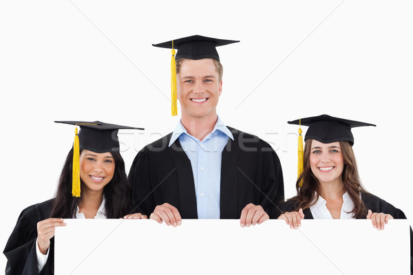 Trois diplômés affiche mains sourire [[stock_photo]] © wavebreak_media