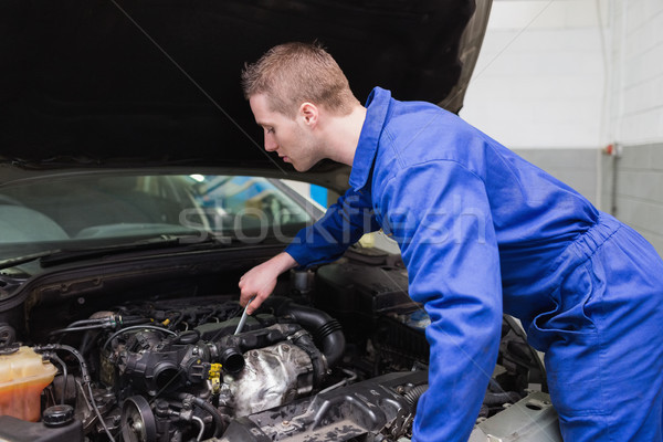 Mechanic working under car bonnet Stock photo © wavebreak_media