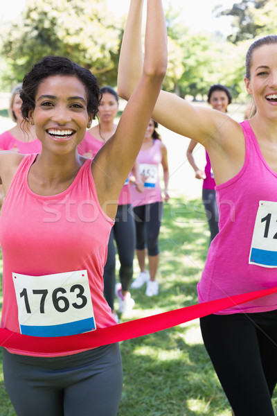 Breast cancer participants winning marathon race Stock photo © wavebreak_media