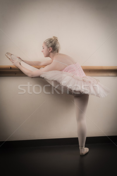 Beautiful ballerina warming up with the barre Stock photo © wavebreak_media