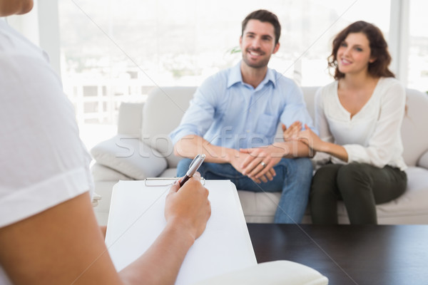 Couple souriant parler thérapeute bureau heureux [[stock_photo]] © wavebreak_media