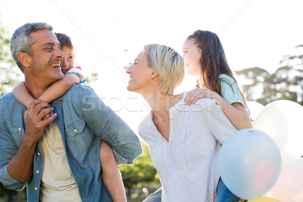 Happy family walking at the park  Stock photo © wavebreak_media