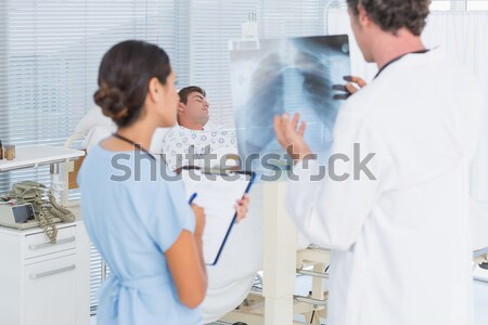 Doctor checking patients xray Stock photo © wavebreak_media
