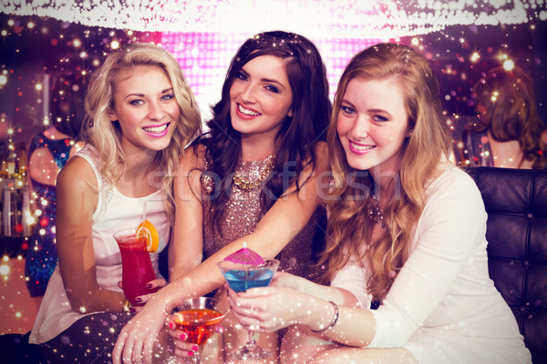 Composite image of friends drinking cocktails  Stock photo © wavebreak_media