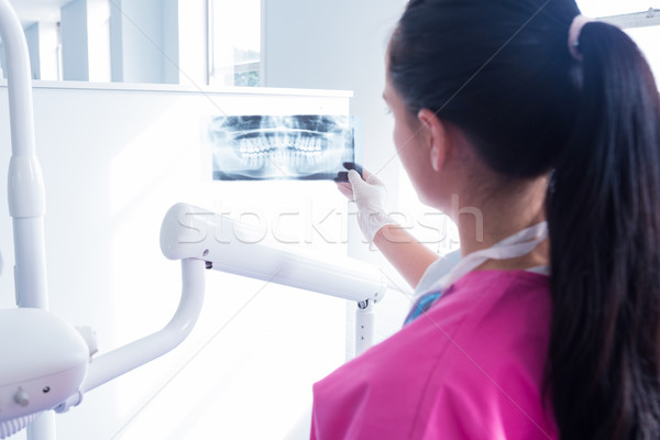 Focused assistant studying x-rays Stock photo © wavebreak_media