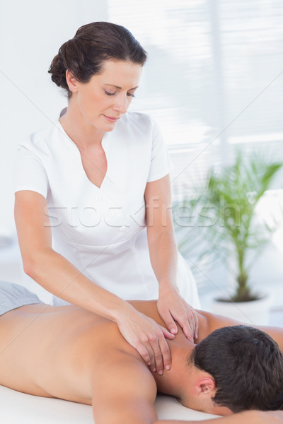 Stock photo: Physiotherapist doing neck massage to her patient
